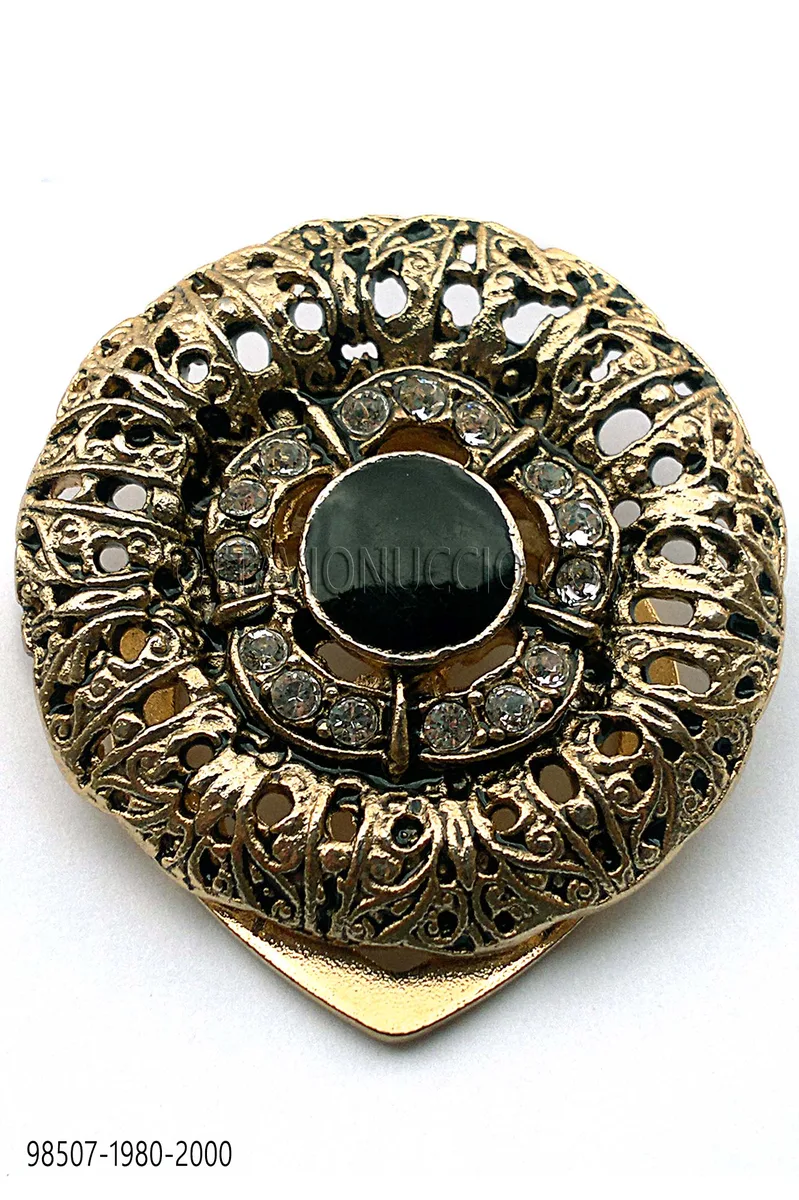 Golden brooch with black enamel