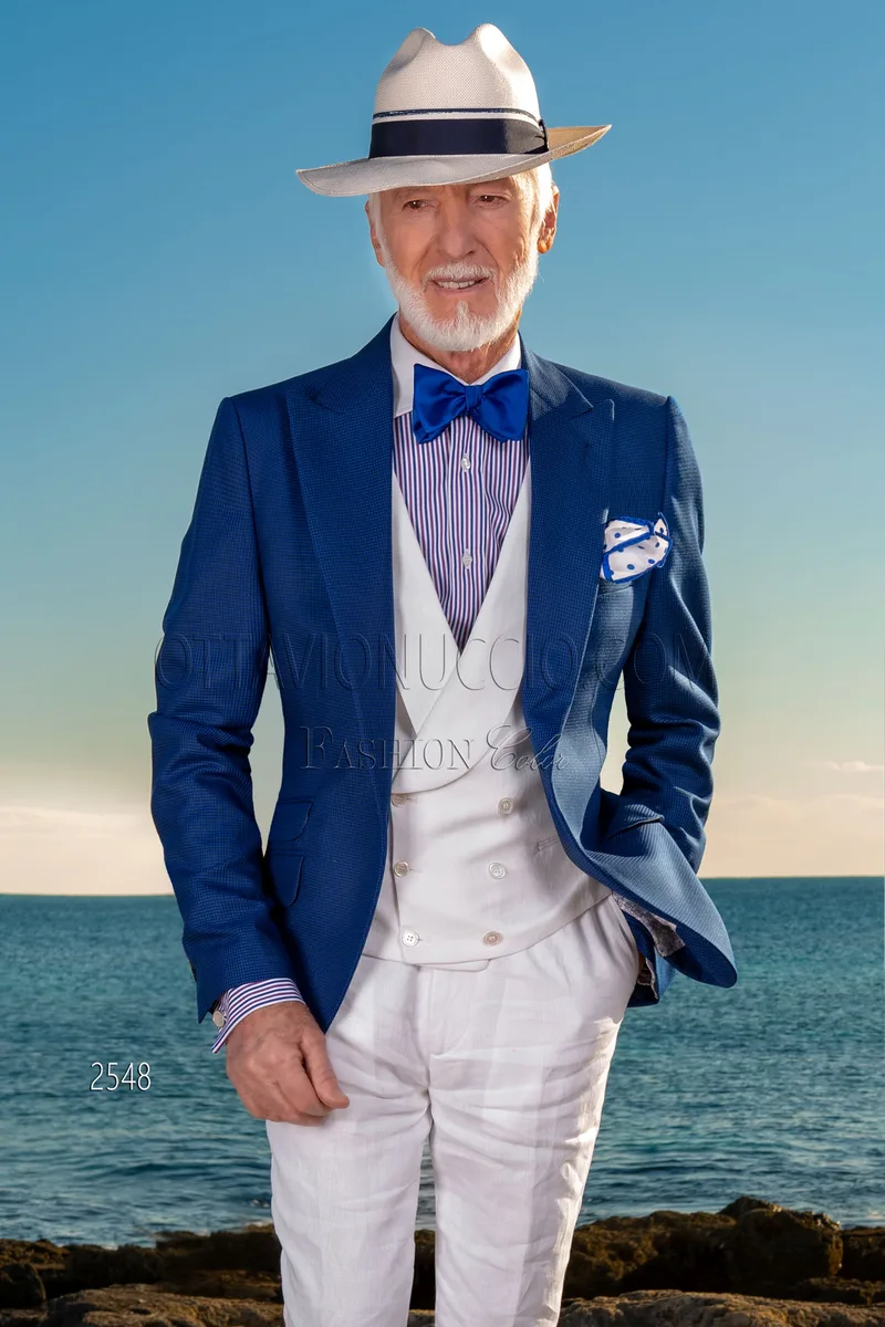 Abito moda uomo giacca blu pied-de-poule con gilet e pantalone bianco 1