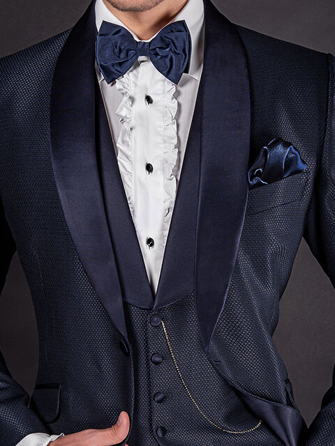 Gilet in microdisegni blu con collo sciallato
